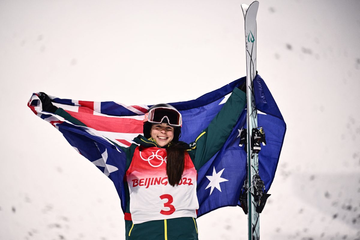 Gold medallist Australia's Jakara Anthony celebrates on the podium during the venue ceremony after the freestyle skiing women's moguls final during the Beijing 2022 Winter Olympic Games at the Genting Snow Park A & M Stadium in Zhangjiakou on February 6, 2022. (Photo by Marco BERTORELLO / AFP) (Photo by MARCO BERTORELLO/AFP via Getty Images)