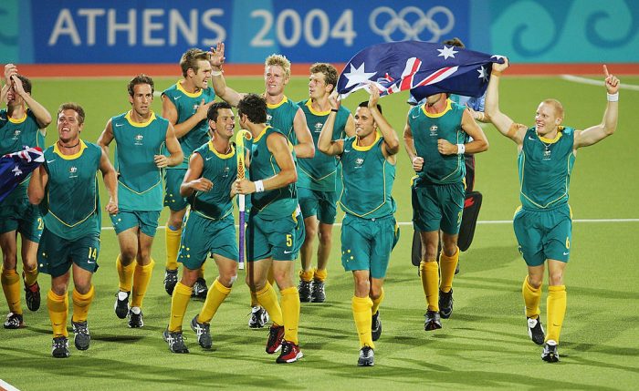 ATHENS - AUGUST 27: The Australian team celebrate winning gold in the men's field hockey gold medal match against the Netherlands on August 27, 2004 during the Athens 2004 Summer Olympic Games at the Helliniko Olympic Complex Hockey Centre in Athens, Greece. (Photo by Stuart Franklin/Getty Images)