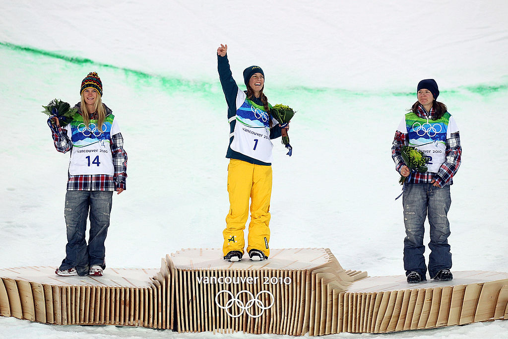 VANCOUVER, BC - FEBRUARY 18: (L-R) Hannah Teter of the United States celebrates winning the silver medal, Torah Bright of Australia gold and Kelly Clark of the United States bronze during the flower ceremony for the Snowboard Women's Halfpipe final on day seven of the Vancouver 2010 Winter Olympics at Cypress Snowboard & Ski-Cross Stadium on February 18, 2010 in Vancouver, Canada. (Photo by Streeter Lecka/Getty Images)