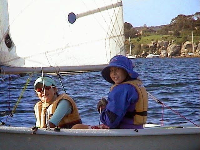 A young Olivia Price sails on Sydney Harbour.