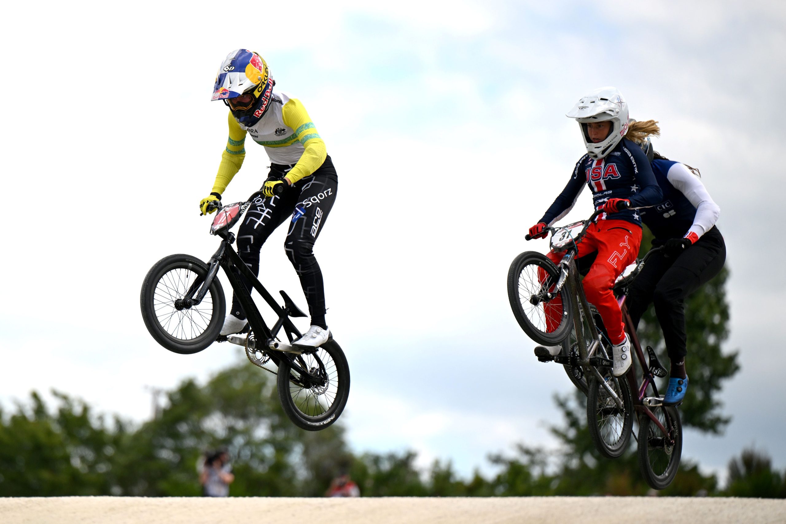 Saya Sakakibara of Australia and Daleny Vaughn of USA compete in the Women's Elite quarter final during the 2024 UCI BMX Racing World Cup on February 11, 2024 in Rotorua, New Zealand. (Photo by Hannah Peters/Getty Images)