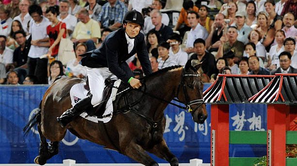 Australia's Shane Rose rides on "All Luck" in the eventing competition of the 2008 Beijing Olympic Games on August 12, 2008 in Hong Kong. Germany won the first two Olympic equestrian gold medals, winning both the team and individual three-day eventing competitions. AFP PHOTO/DDP/David Hecker (Photo credit should read DAVID HECKER/AFP via Getty Images)